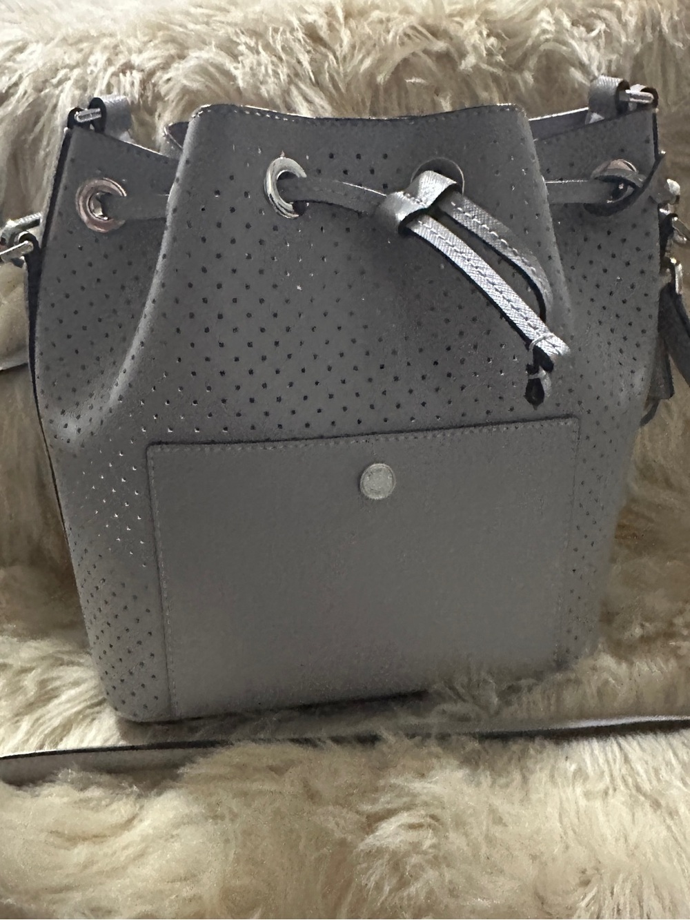 Michael Kors Perforated Drawstring Bucket Bag in Gray